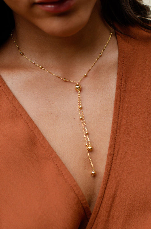 Nuria - Gold Tie Necklace/ Ball Details